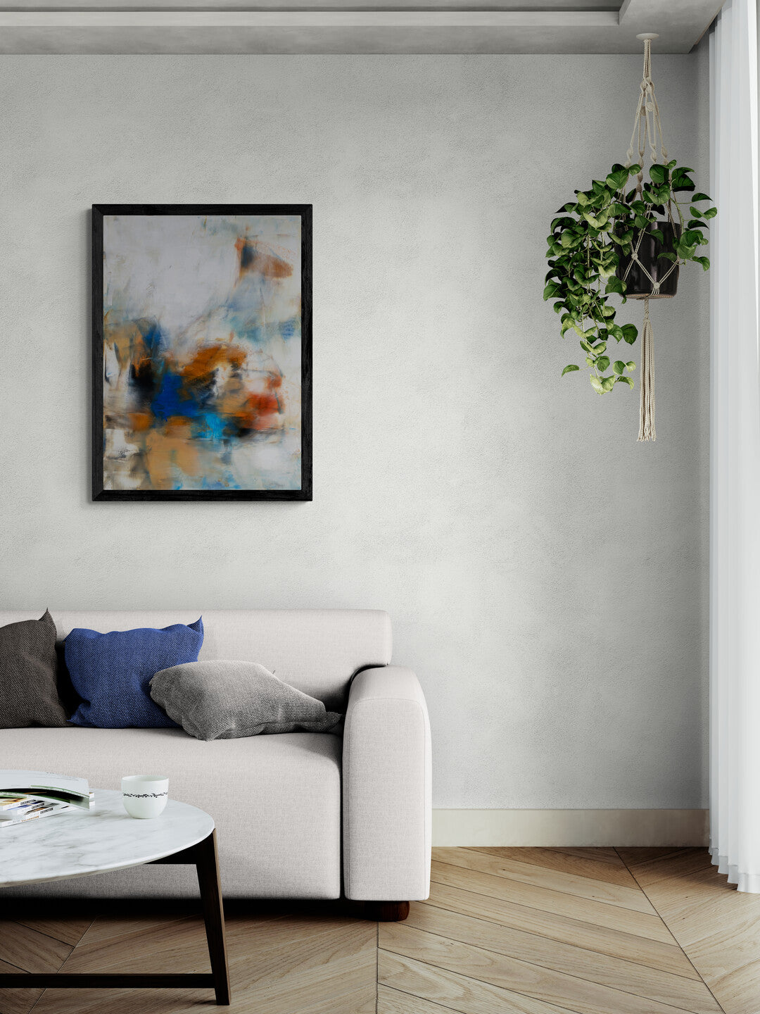 Living room with a sofa and an abstract painting in the wall