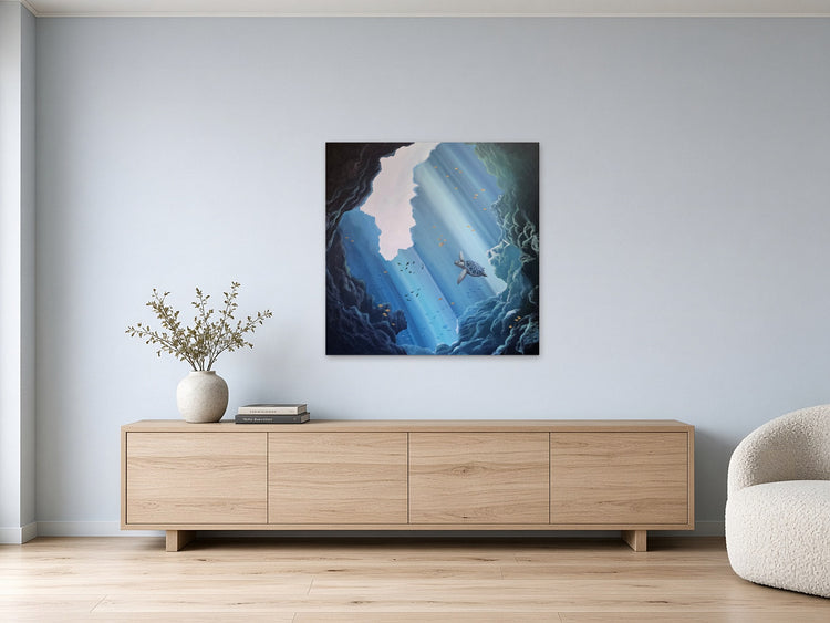 Below the Surface by Angie Hickson shown above a low media unit in a living room