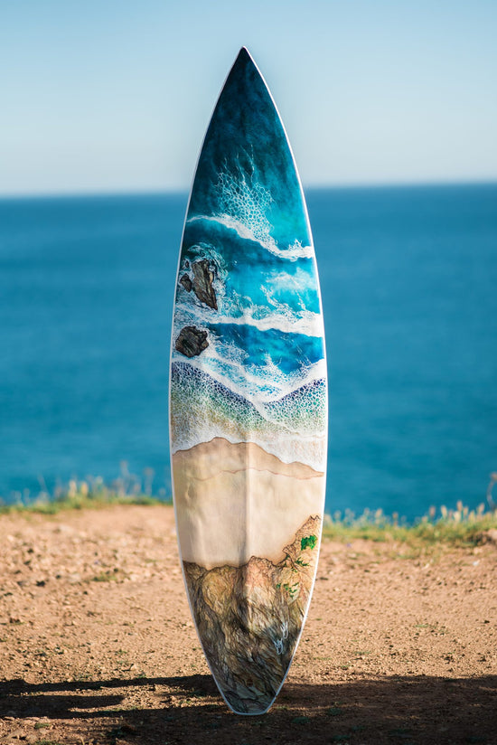 Coast Surfboard by Angie Hickson – hand-painted surfboard with a coastal aerial view