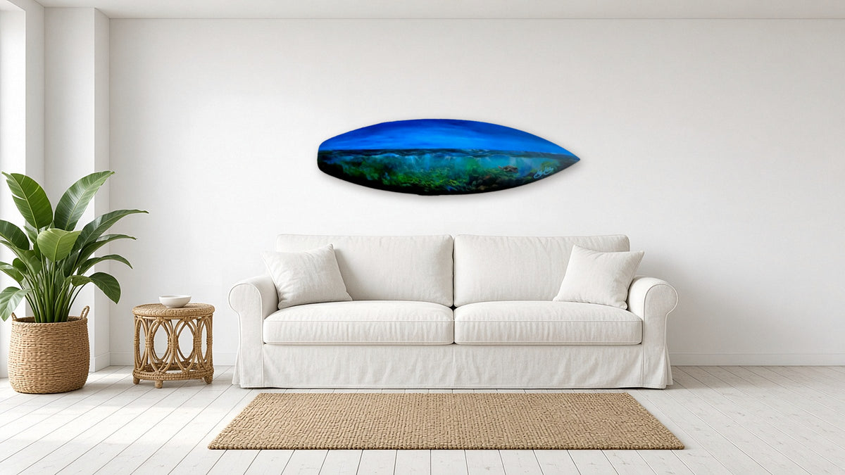 Deep Blue Drift by Angie Hickson shown above a sofa in a coastal living room