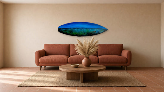 Deep Blue Drift by Angie Hickson shown above a sofa in a boho living room