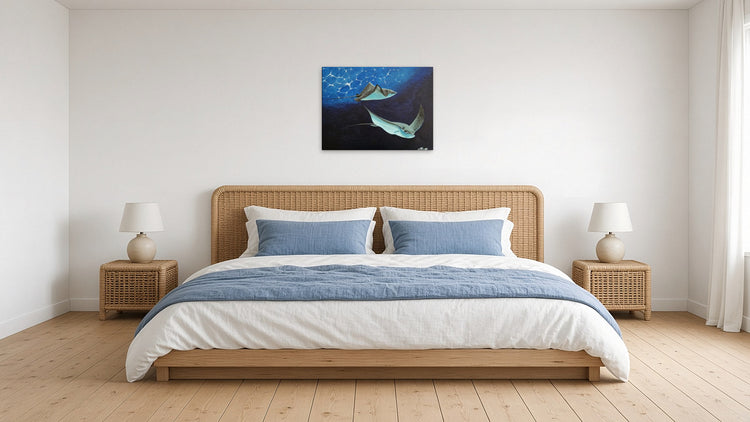 Rays by Angie Hickson shown above a rattan headboard in a coastal bedroom