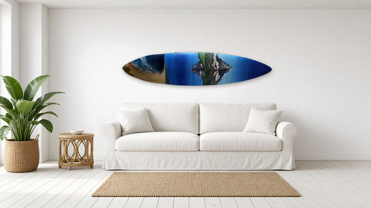 Serene Surfboard by Angie Hickson shown above a sofa in a coastal living room