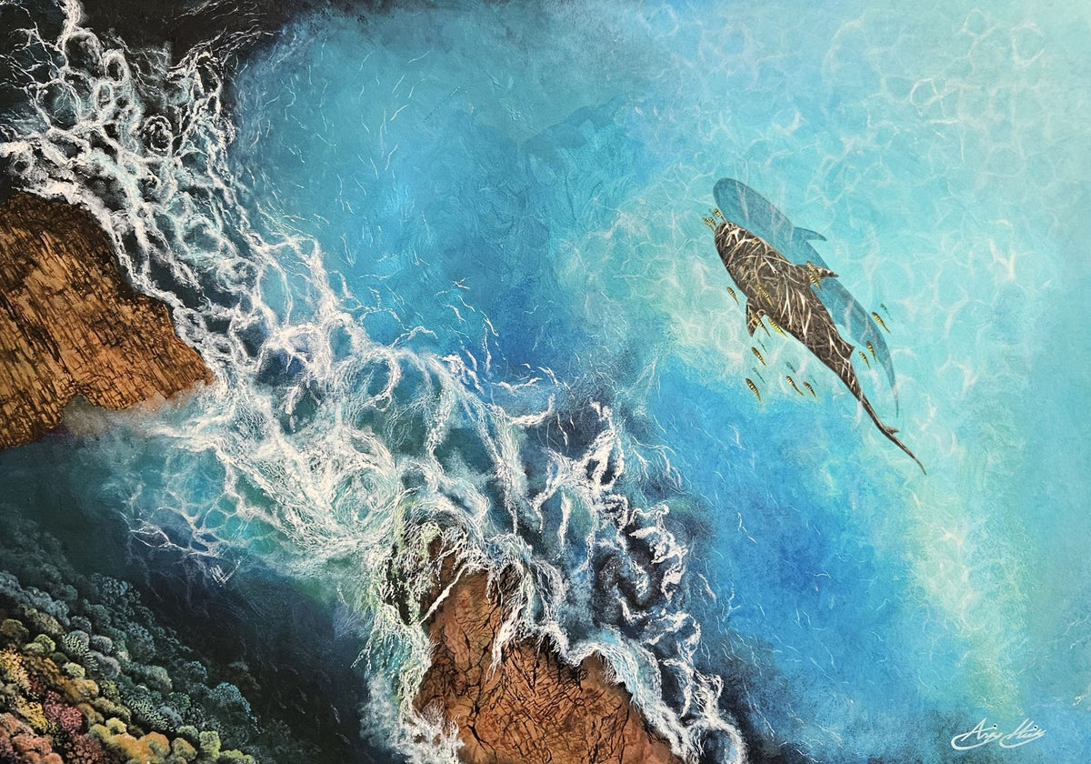Serene by Angie Hickson – aerial view of waves breaking over rocks with a sea turtle