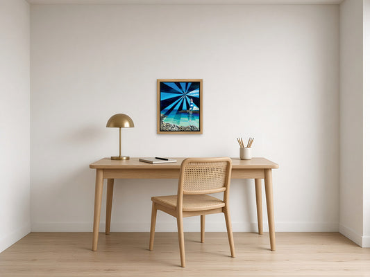 St Marta Lighthouse by Angie Hickson shown framed in oak above a writing desk in a small study