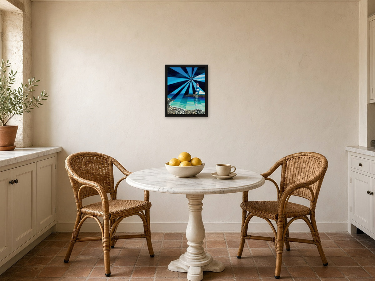 St Marta Lighthouse by Angie Hickson shown framed in black above a bistro table in a kitchen breakfast nook