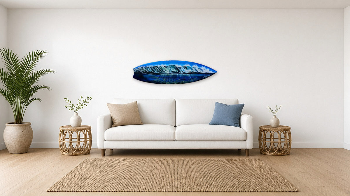 Waves Surfboard by Angie Hickson shown above a sofa in a coastal living room