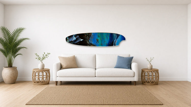 Wonder Surfboard by Angie Hickson shown above a sofa in a coastal living room