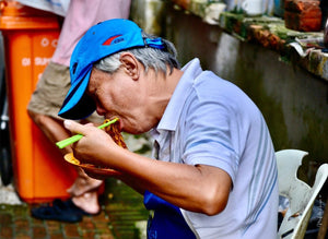 The asian man eating